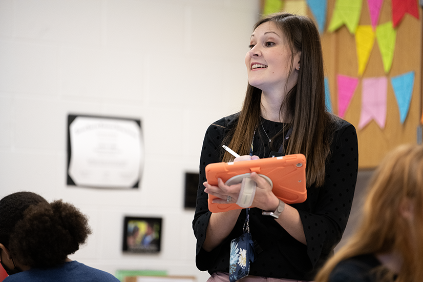 A smiling female teacher in a Cabell County Schools classroom 